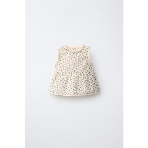 BLUSA FLORES - Crudo | ZARA España