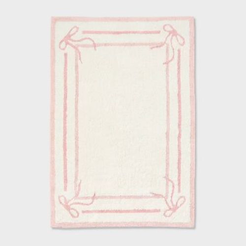 4'x5'6" Bow Border Kids' Area Rug Pink - Pillowfort™
