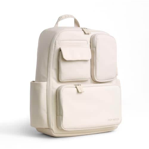 Itzy Ritzy Utility Diaper Bag Backpack  Features 17 Pockets (Including 2 Insulated Bottle Holders) & Trolley Sleeve and Includes Stroller Straps & Changing Pad  Part of the Belong Collection (Cream)