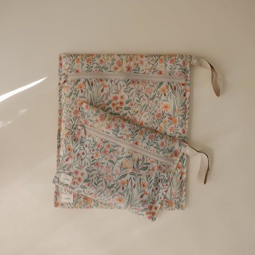 mushie Water Resistant Wet Bags | Large & Small Reusable Storage Bag for Baby Items and Travel | Zippered Pockets with Handle | Machine Washable, Set of 2 (Pastel Blooms)
