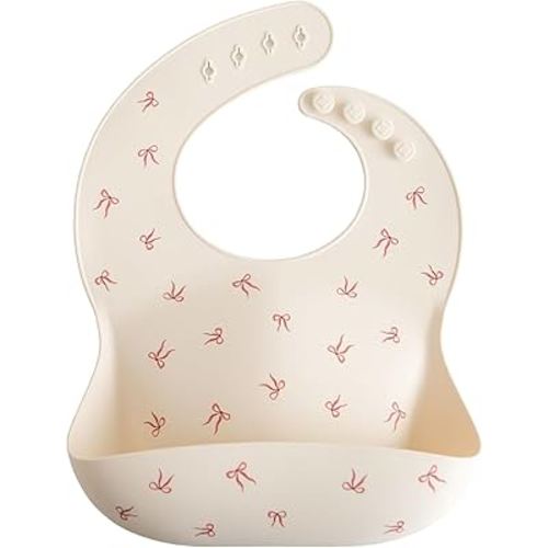 mushie Silicone Baby Bib | Adjustable Fit Waterproof Bibs (Bows)