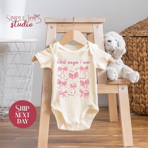 God Says I Am Baby Onesie® - Christian Infant Bodysuit with Bows