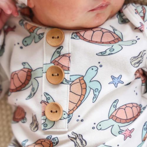 Newborn Baby Knot Gown & Hat Set in Turtley Rad | Caden Lane