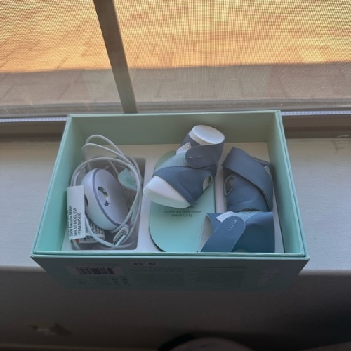 Owlet Blue Baby Monitor Sock with charging cable and base