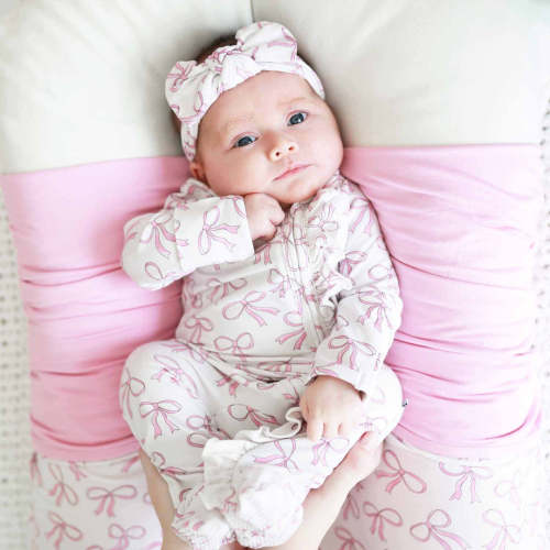 Blushing Bows Ruffle Zipper Footie