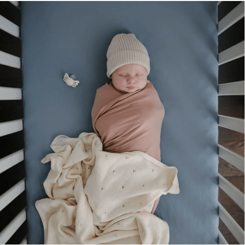 Mushie Stretchy Organic Crib Sheet – Babyletto - Tradewinds