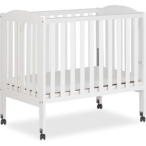 Dream On Me 2-in-1 Folding Portable Compact Mini Baby Crib in White, GreenGuard Gold & JPMA, US Patented Flat Folding System, Locking Wheels, 1″ Mattress Pad, Space-Saving Quck Fold Easy Storage