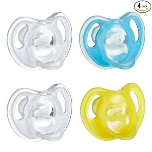 Tommee Tippee Ultra-Light Silicone Pacifier, 6-18 Months, Symmetrical One-Piece Design, BPA-Free Silicone Binkies, Clear/Blue/Yellow, Pack of 4