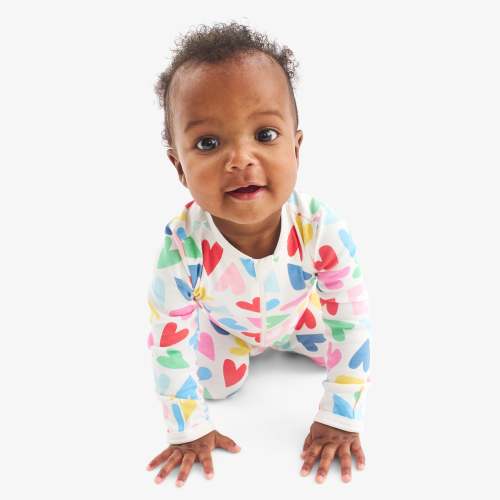 Baby organic zip footie in rainbow candy hearts | Primary.com