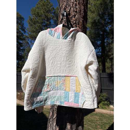 Creme colored Hoodie with pieces of a child’s quilt added for personality.