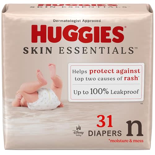 Huggies Size Newborn Diapers, Skin Essentials Baby Diapers, Size Newborn (6-9 lbs), 31 Count, Packaging May Vary