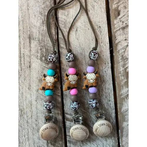 Sitting Highland Cow Pacifier Holder - TikTok Shop