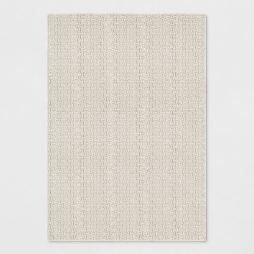 7'x10' Washable Solid Machine Tufted Area Rug Tan - Threshold™