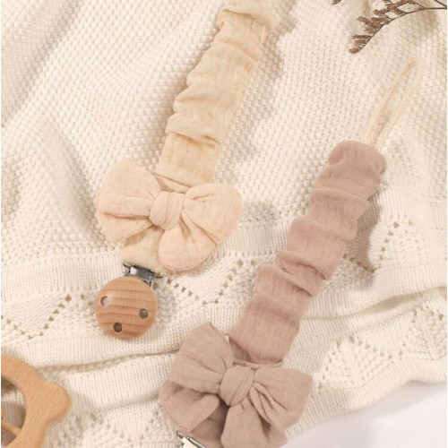 2pcs Baby Solid & Printed Pacifier Clips, Bowknot Pacifier Holder, Wooden 3-Hole Pacifier Clips, Suitable For Daily Use In Blue, Pink, Khaki | SHEIN USA