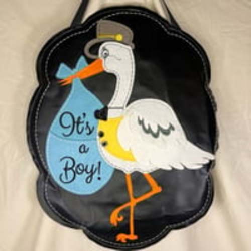 It’s a baby felt door hanger.  It’s a boy!