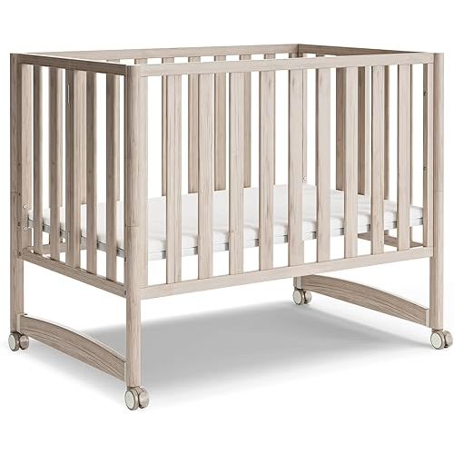 MAMAZING EvoNook 6-in-1 Convertible Mini Crib, 100% New Zealand Wood, Portable Mini Cribs with Wheels for Small Spaces, GREENGUARD Gold Certified, Washed Natural