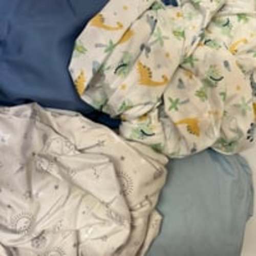 Set of 4 New never used Crib sheets