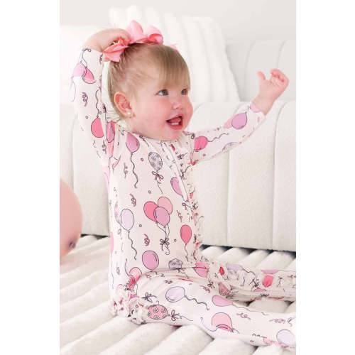 Party Time Ruffle Zipper Footie in Pink | Caden Lane