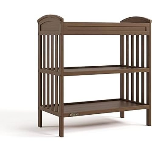 Graco Benton Changing Table with Bonus Water-Resistant Changing Pad (Hazelnut) - GREENGUARD Gold Certified, Includes Diaper Change Pad with Safety Strap, 2 Open Storage Shelves for Organizing