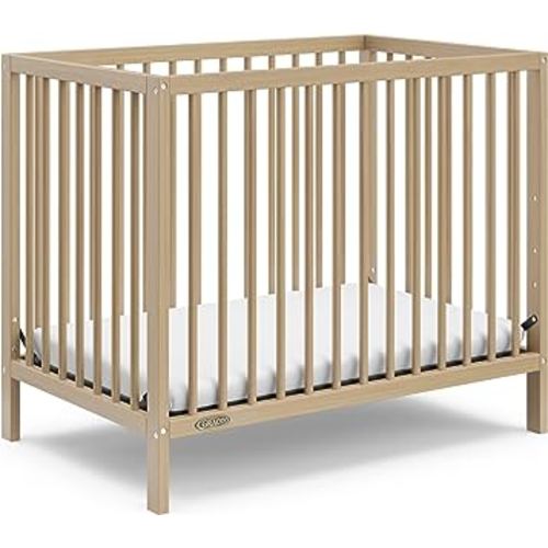 Graco Teddi 4-in-1 Convertible Mini Crib with Bonus Water-Resistant Mattress (Driftwood) – GREENGUARD Gold Certified, 2.75-Inch Mattress Included, Ideal for Small Spaces, Easy 30-Minute Assembly