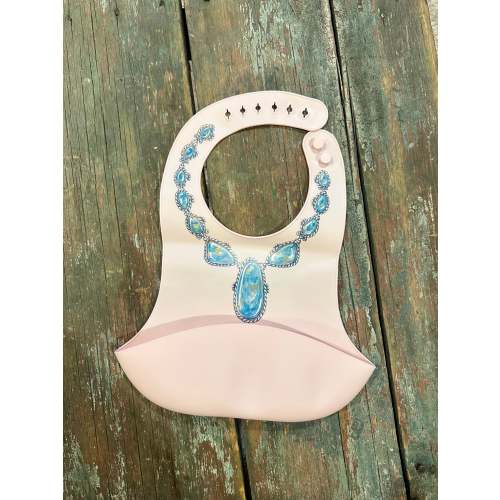 Blue lariat necklace on pink no drip baby bib