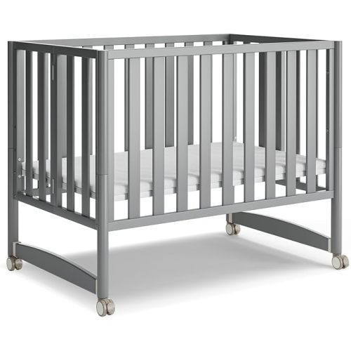 MAMAZING EvoNook 6-in-1 Convertible Mini Crib, 100% New Zealand Wood, Portable Mini Cribs with Wheels for Small Spaces, GREENGUARD Gold Certified, Grey