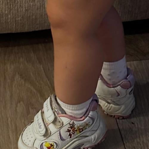 Little Buddy white sneakers with cartoon character...