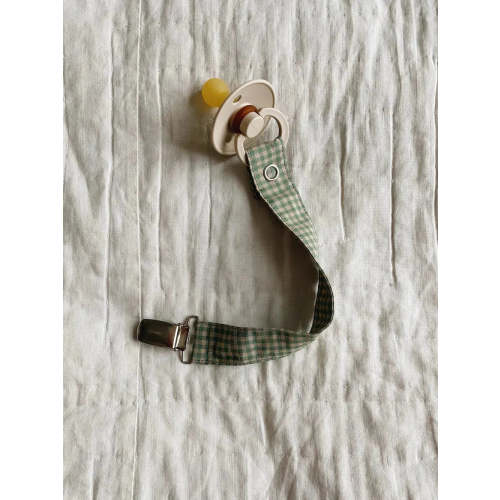 Pacifier clip green check