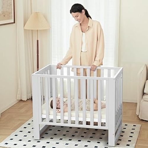 EvoNest Baby Crib, 6 in 1 Convertible Mini Crib with Wheels, 100% New Zealand Pinewood Growing Bed, 4 Adjustable Mattress Height，GREENGUARD Gold Certified (Milk)