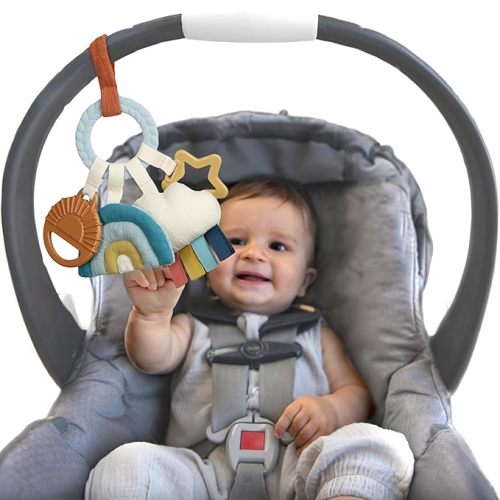 Itzy Ritzy Teething Activity Travel Toy - Bitzy Busy Ring Infant Teething Toy Features Braided Ring & Dangling Toys, Includes Teether, Textured Ribbons, Crinkle Sound & Jingle Bell - 0 Months & Up (Rainbow)