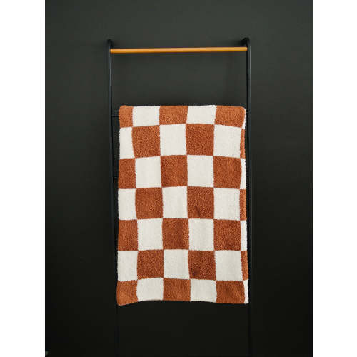 rust checkered plush blanket