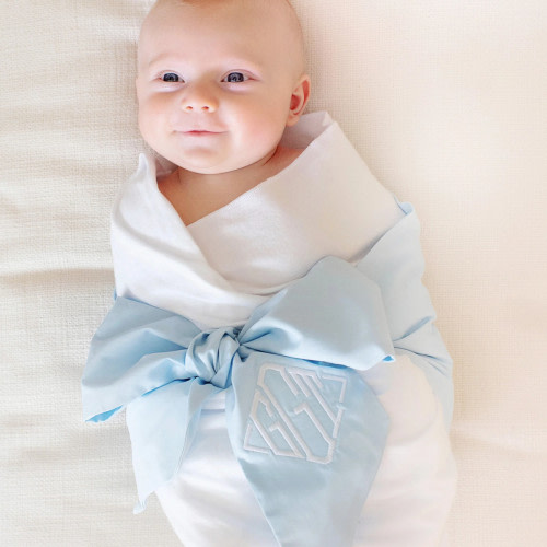 Bow Swaddle- Embroidered. See below: 
Color: Buckhead Blue
Location: Tail of Tie
Embroidery Style/Font: Jamie
Font Color: Worth Avenue White
Text: LFA