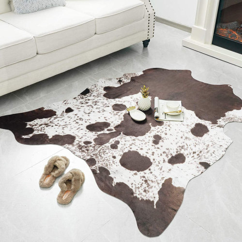 Gracie Oaks Ganote Animal Print Faux Cowhide Brown Area Rug & Reviews | Wayfair