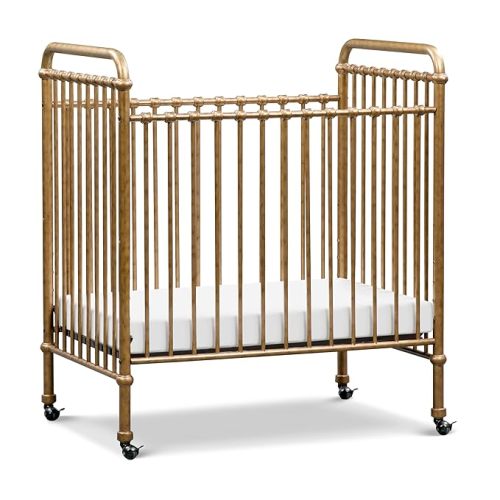 Namesake Abigail 3-in-1 Portable Baby Crib with Wheels - GREENGUARD Gold Certified Convertible Crib to Toddler Bed & Daybed - Metal Baby Bed w/ 4 Adjustable Mattress Heights, for Small Spaces - Gold