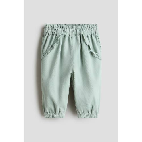 RUFFLE-TRIMMED CORDUROY PANTS