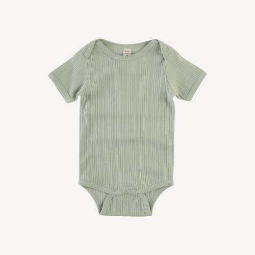 short sleeve lap neck bodysuit | iceberg green | organic cotton multi – kate quinn