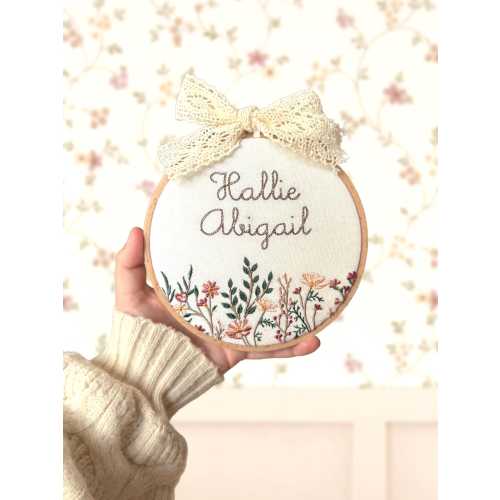 Baby name sign embroidered with flowers | personalised announcement plaque and nursery wall hanging