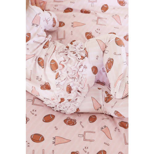 Tiny Touchdowns Ruffle Zipper Footie in Pink | Caden Lane