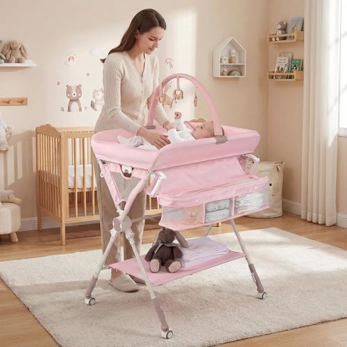 BABY JOY Portable Baby Changing Table, Foldable Diaper Changing Station with Wheels, Adjustable Height, Large Storage Rack, Removable Activity Arch, Mobile Nursery Organizer for Newborn Infant (Pink)