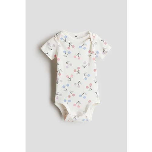 PRINTED BODYSUIT WITH LAP SHOULDERS