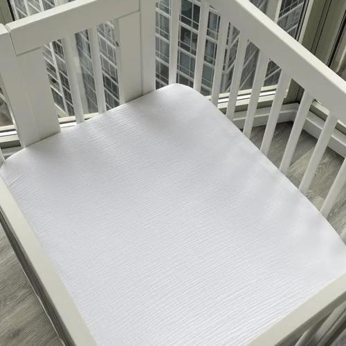 Organic Muslin Fitted Sheet for Nestig Cribs: Soft Baby Bedding - Primary color: Yellow