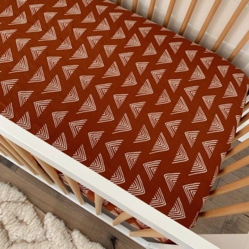 Muslin Crib Sheet, Rust Triangle Mudcloth