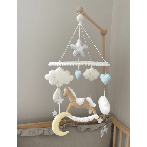 Brown rocking horse mobile with clouds