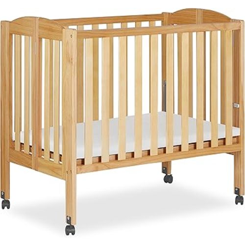 Dream On Me 2-in-1 Folding Portable Compact Mini Baby Crib in Natural, GreenGuard Gold & JPMA, US Patented Flat Folding System, Locking Wheels, 1″ Mattress Pad, Space-Saving Quick Fold Easy Storage