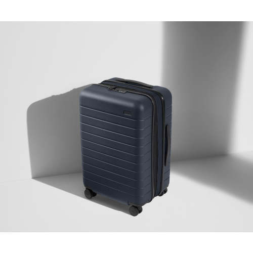 The Bigger Carry-On Flex in Navy Blue