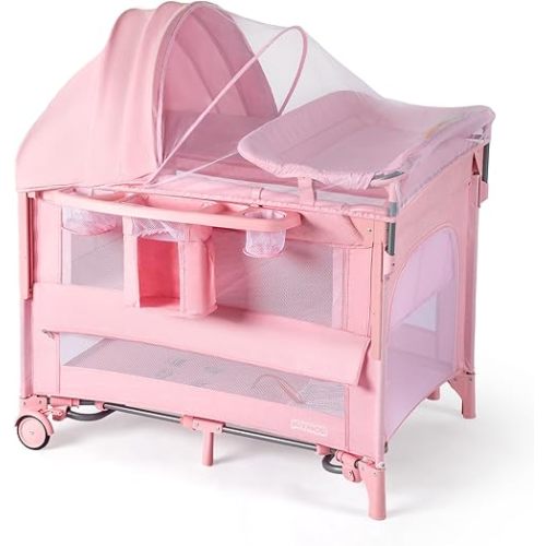 JOYMOR 9 in 1 Bedside Bassinet with Changing Table, Pack and Play with Bassinet, Convert to Rocking Baby Bed with Electric Music Center, Mosquito Net, Storage,Pink