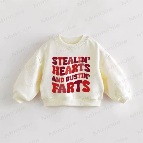 STEALIN' HEARTS AND BUSTIN' FARTS Baby Toddler Cream Sweatshirt
