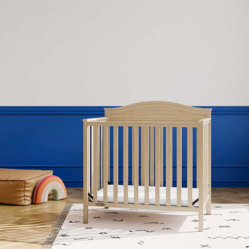 Graco Stella 4-in-1 Convertible Baby Mini Crib with Mattress, Driftwood
