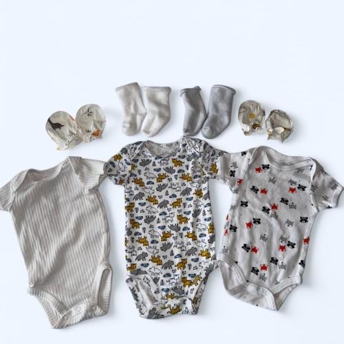 White and multicolored baby boy or girl bodysuit...
