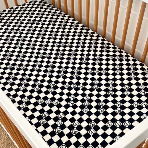 Stretch Crib Sheet, Black Peace Checkerboard